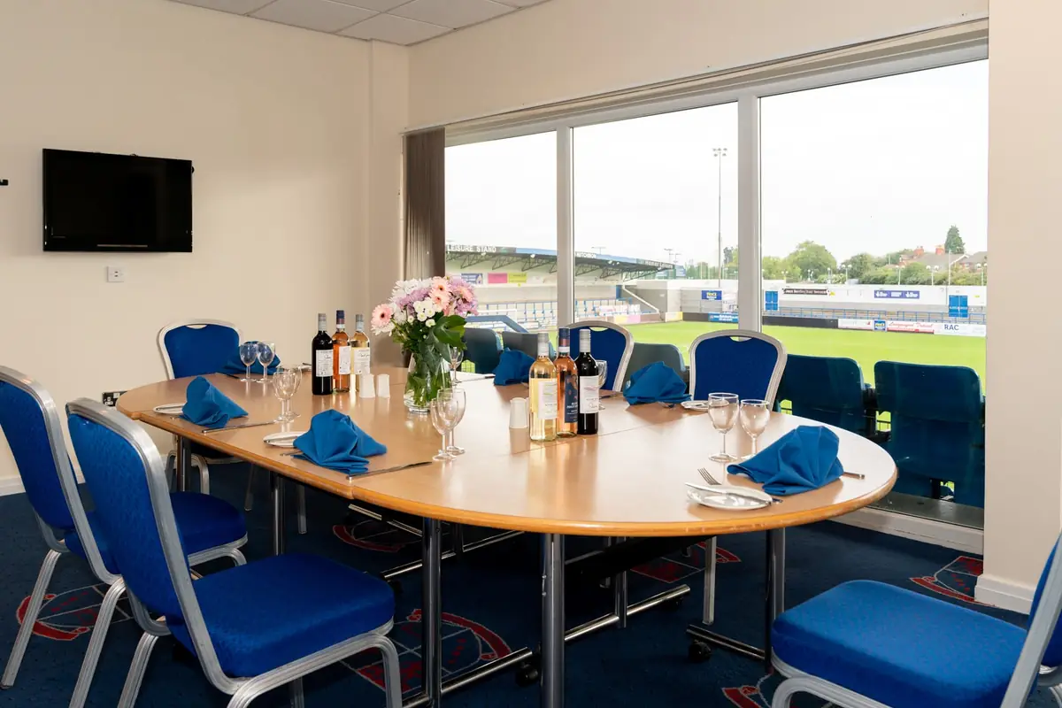 A conference room set up for an event at The West Stand, Telford